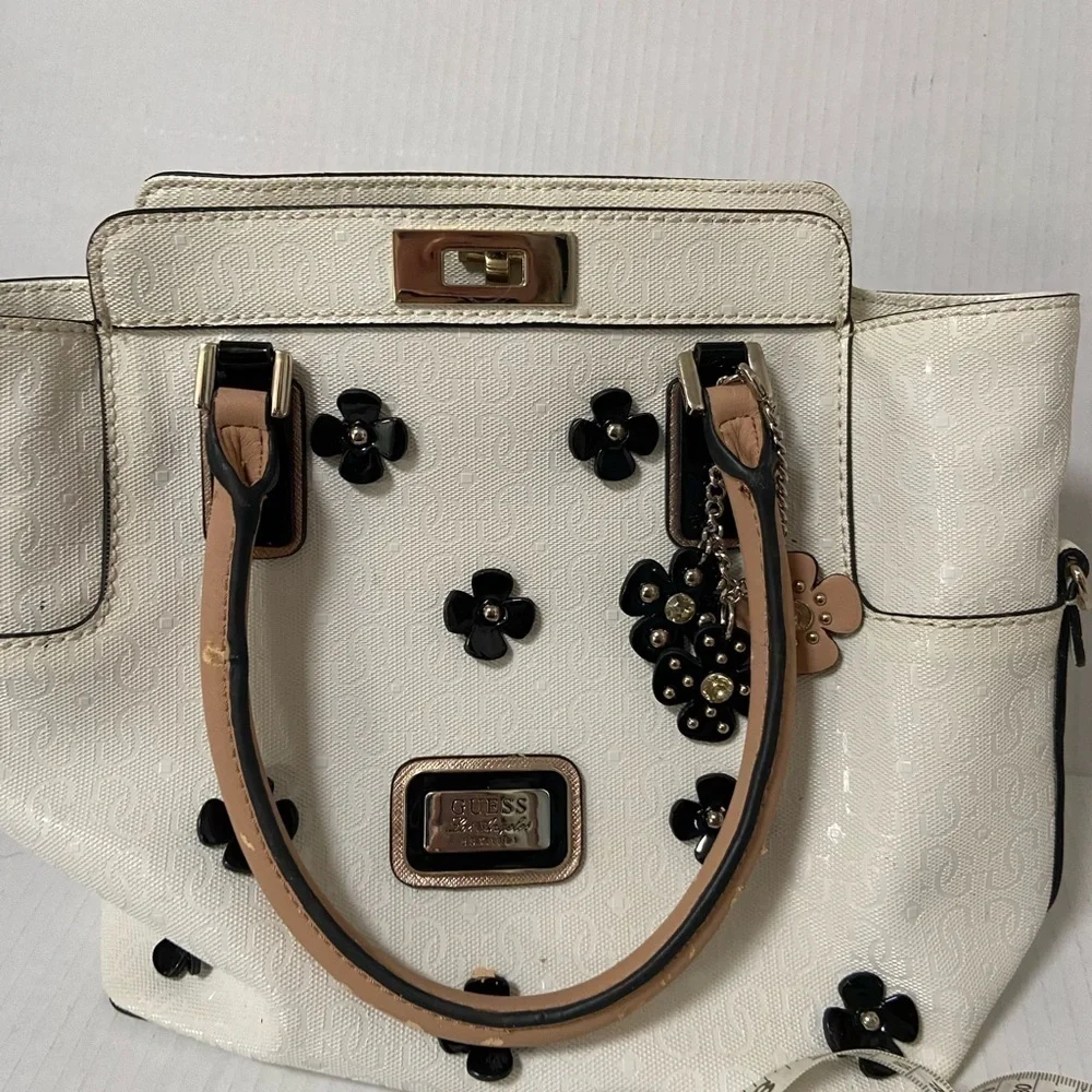 Guess purse cream w black flowers useful but well loved $49